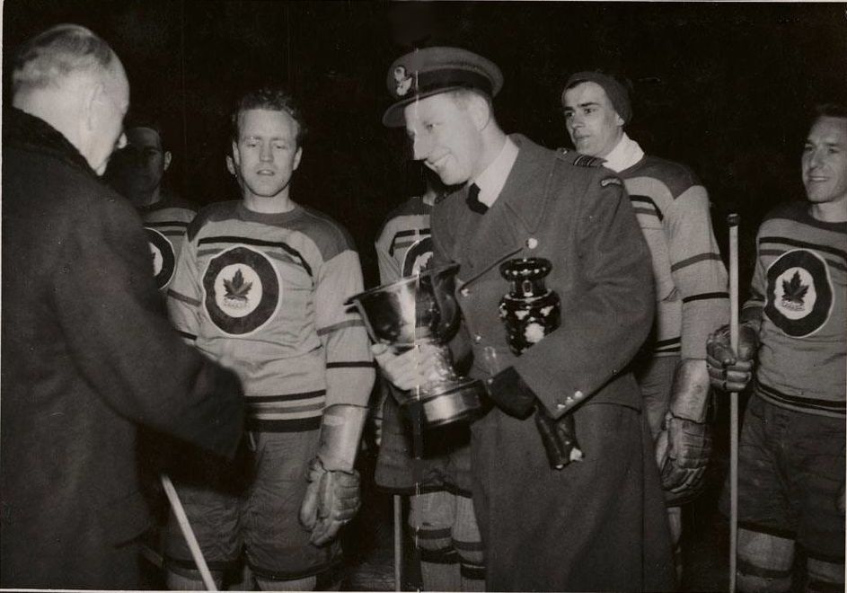 Photo:  Dr Sandy Watson accepts WHC trophy Prague 17 Feb 1948